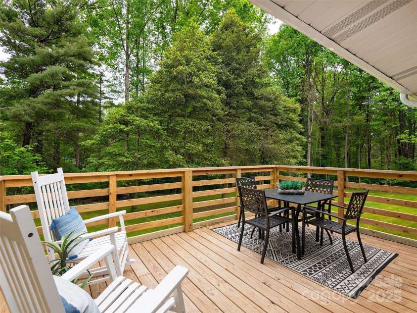 16 Emerson Poore Drive, Candler, NC 28715.  MLS# CAR4256902, YatesRealty ID 12551. Back deck off living room