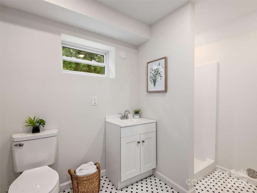 16 Emerson Poore Drive, Candler, NC 28715.  MLS# CAR4256902, YatesRealty ID 12551. Bath with walk-in shower in basement