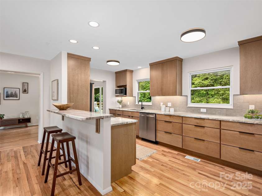 16 Emerson Poore Drive, Candler, NC 28715.  MLS# CAR4256902, YatesRealty ID 12551. Breakfast bar in kitchen
