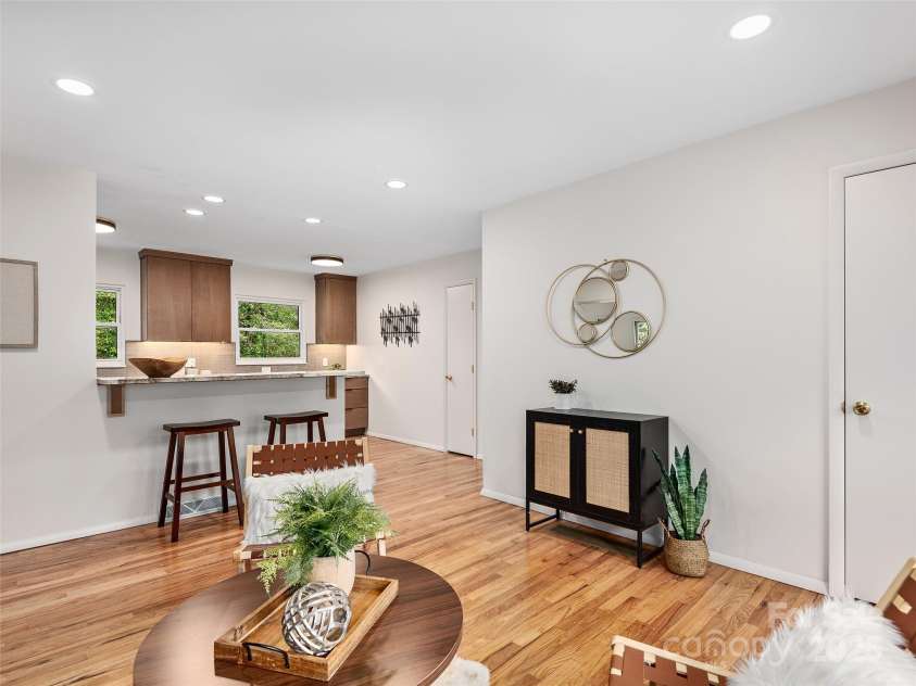 16 Emerson Poore Drive, Candler, NC 28715.  MLS# CAR4256902, YatesRealty ID 12551. Den open to kitchen