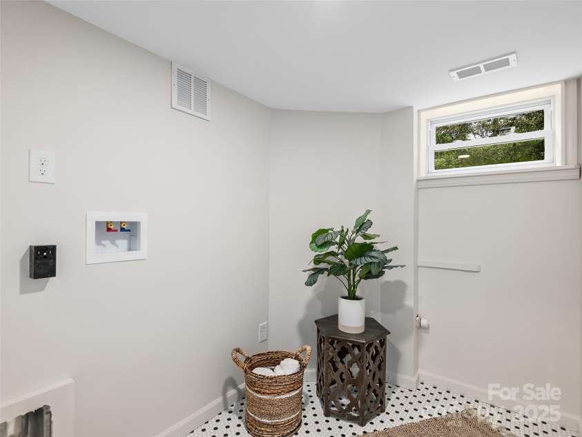 16 Emerson Poore Drive, Candler, NC 28715.  MLS# CAR4256902, YatesRealty ID 12551. Laundry room in basement