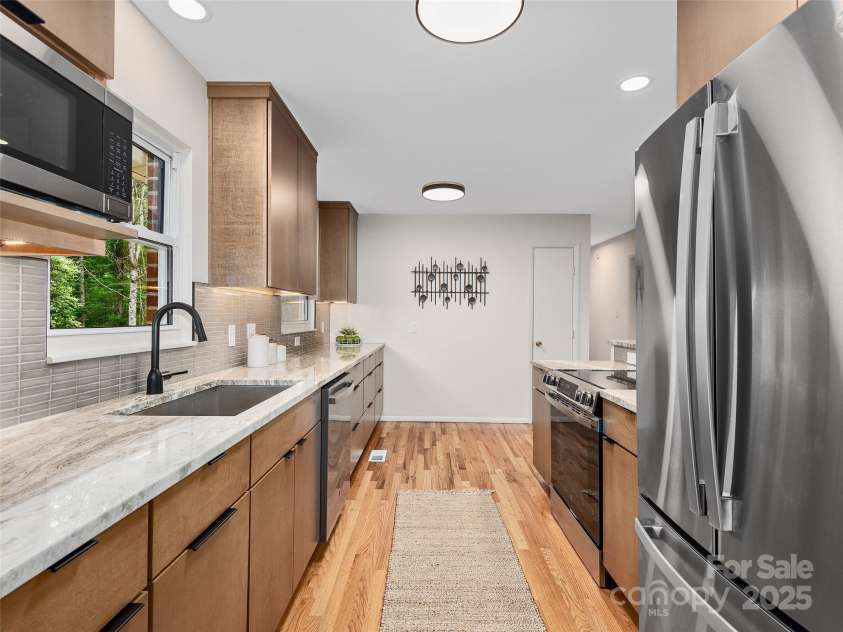 16 Emerson Poore Drive, Candler, NC 28715.  MLS# CAR4256902, YatesRealty ID 12551. Lovely kitchen with modern finishes