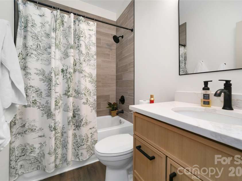 98 Lexxi Lane, Tryon, NC 28782.  MLS# CAR4410440, YatesRealty ID 12560. Second bathroom between the second and third bedrooms.! Very elegantly appointed with special plumbing fixtures!