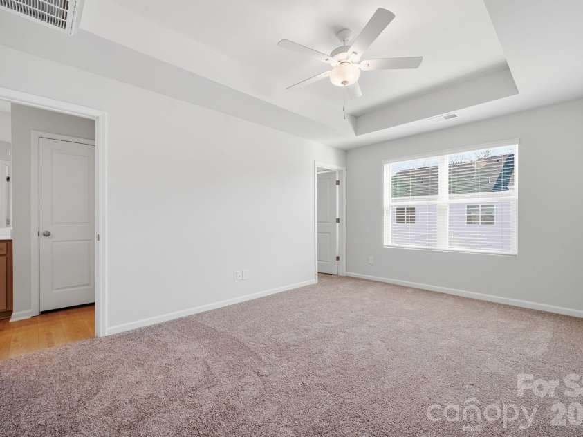 5107 Orchardview Way, Charlotte, NC 28216.  MLS# CAR4241432, YatesRealty ID 12561. Primary Bedroom with 9' Tray Ceiling