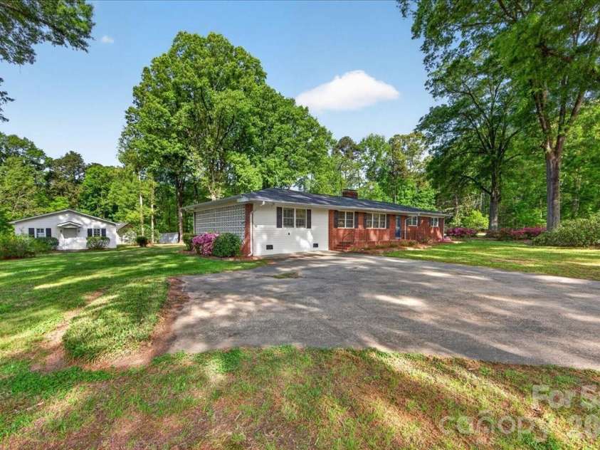 3229 Zelda Lane, Matthews, NC 28105.  MLS# CAR4366492, YatesRealty ID 12580. Front Side angle 