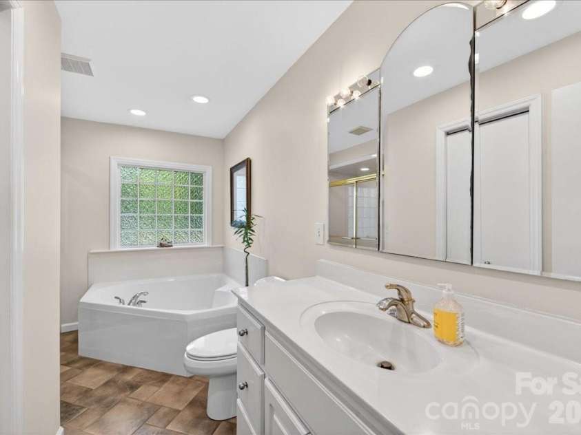 3229 Zelda Lane, Matthews, NC 28105.  MLS# CAR4366492, YatesRealty ID 12580. Primary Bathroom