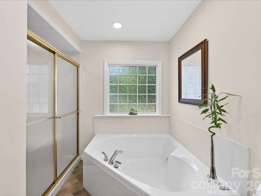 3229 Zelda Lane, Matthews, NC 28105.  MLS# CAR4366492, YatesRealty ID 12580. Primary Bathroom