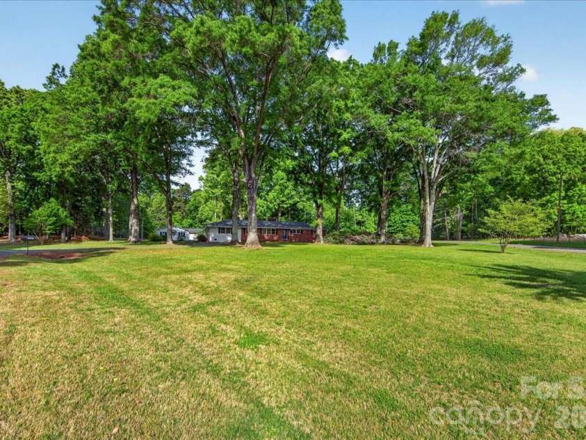 3229 Zelda Lane, Matthews, NC 28105.  MLS# CAR4366492, YatesRealty ID 12580. Road view