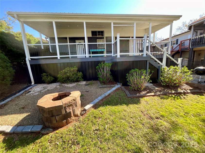 222 Badin View Road, New London, NC 28127.  MLS# CAR4239141, YatesRealty ID 12588. Back yard fire pit
