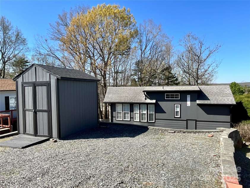 222 Badin View Road, New London, NC 28127.  MLS# CAR4239141, YatesRealty ID 12588. Parking pad and storage building