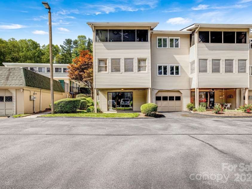 411 Britton Creek Drive, Hendersonville, NC 28791.  MLS# CAR4244943, YatesRealty ID 1259. Rear has garage and walk out basement.