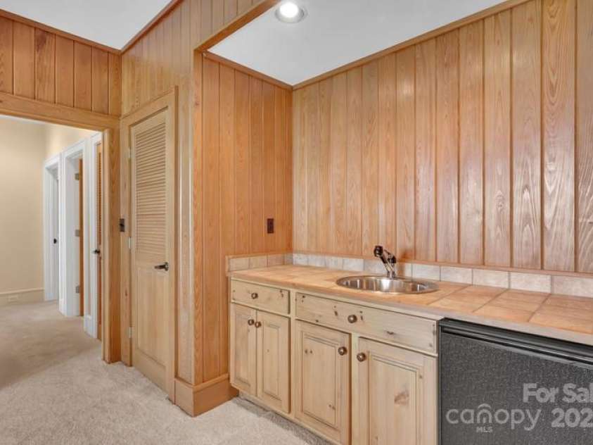 721 Lakeside Drive, Lake Toxaway, NC 28747.  MLS# CAR4240541, YatesRealty ID 1259. Bar area in family room