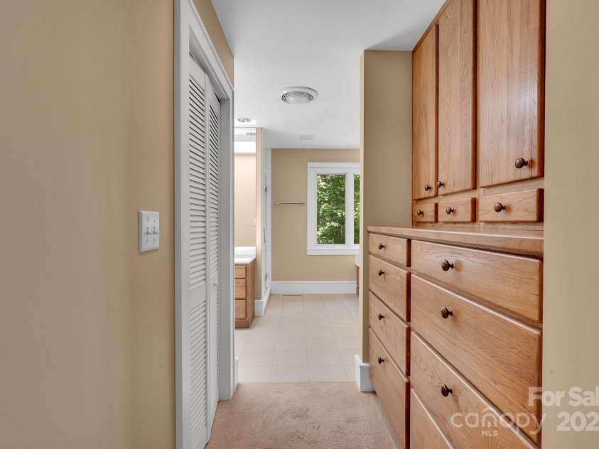 721 Lakeside Drive, Lake Toxaway, NC 28747.  MLS# CAR4240541, YatesRealty ID 1259. Built-ins in primary bedroom