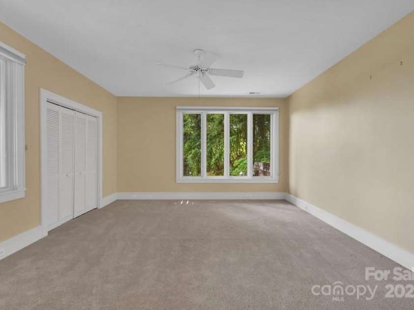 721 Lakeside Drive, Lake Toxaway, NC 28747.  MLS# CAR4240541, YatesRealty ID 1259. Downstairs guest bedroom