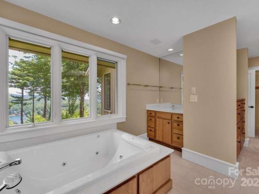 721 Lakeside Drive, Lake Toxaway, NC 28747.  MLS# CAR4240541, YatesRealty ID 1259. Primary bath 2