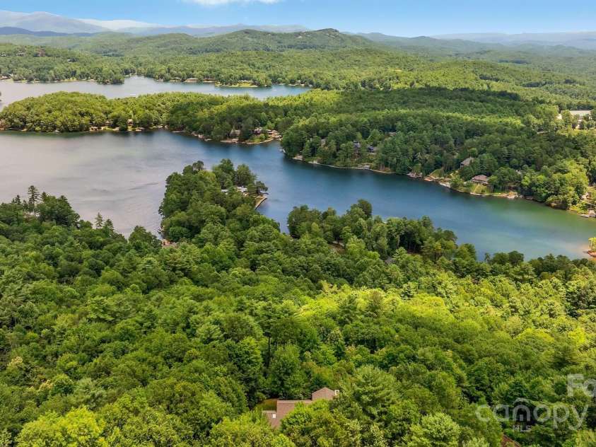 721 Lakeside Drive, Lake Toxaway, NC 28747.  MLS# CAR4240541, YatesRealty ID 1259. The lake beyond
