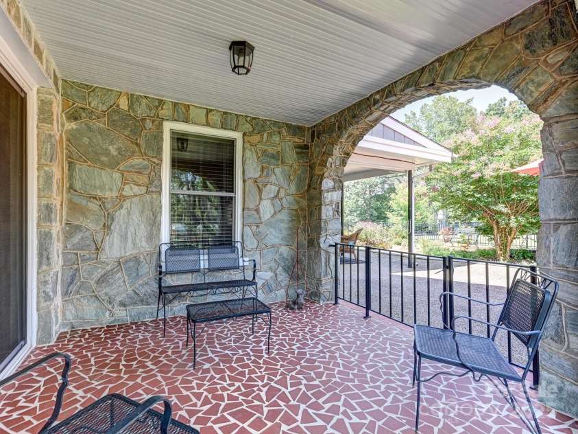 1771 Drexel Road, Valdese, NC 28690.  MLS# CAR4171321, YatesRealty ID 12591. Covered Patio by Garden