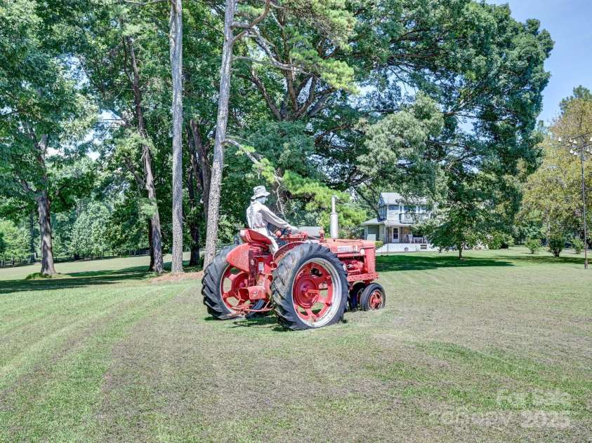 1771 Drexel Road, Valdese, NC 28690.  MLS# CAR4171321, YatesRealty ID 12591. Tractor with Joe the Farmer