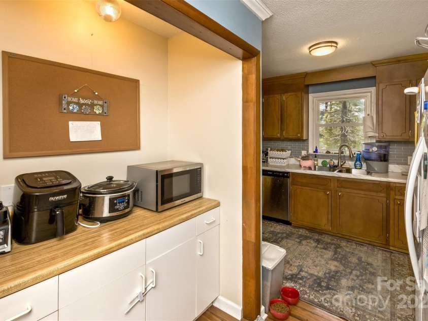 117 White Pine Lane, Morganton, NC 28655.  MLS# CAR4246633, YatesRealty ID 12597. Kitchen has a separate bar area. Multiple uses!