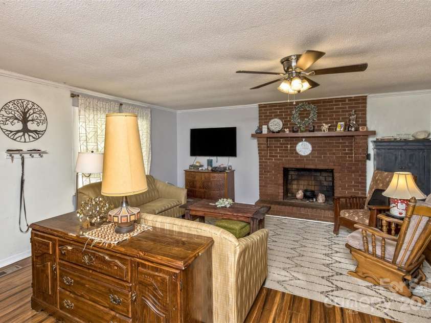 117 White Pine Lane, Morganton, NC 28655.  MLS# CAR4246633, YatesRealty ID 12597. Living room w/fireplace!