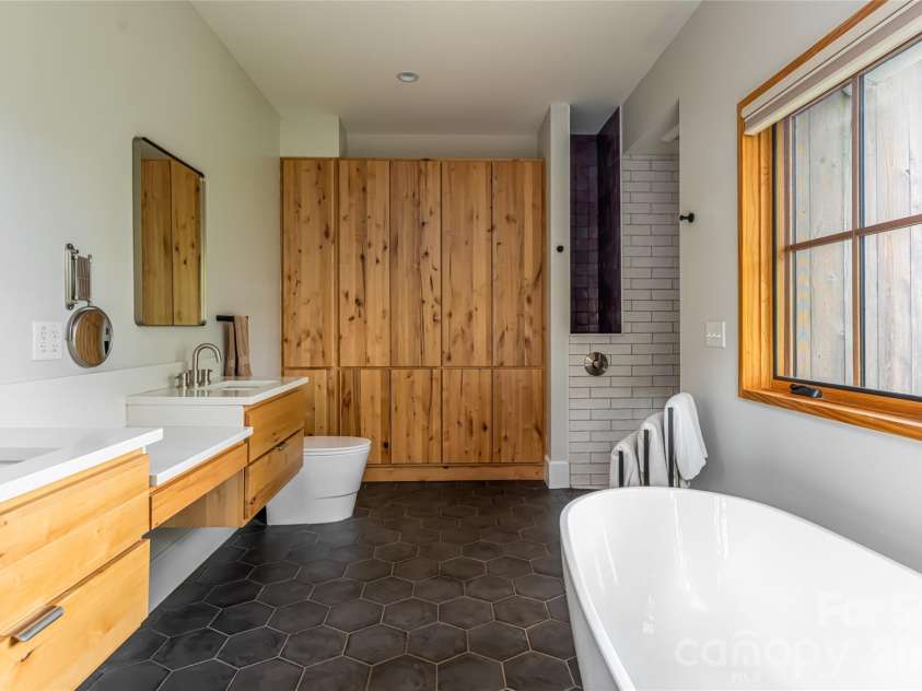 7 Bee Balm Way, Asheville, NC 28804.  MLS# CAR4290500, YatesRealty ID 12598. Primary bath with custom features
