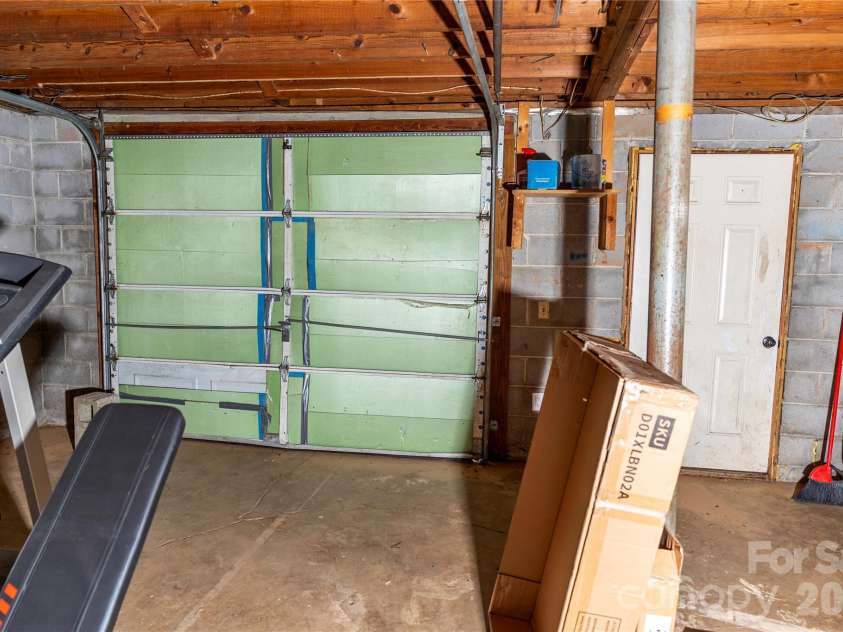 57 Gribble Road, Franklin, NC 28734.  MLS# CAR4377789, YatesRealty ID 126. Garage Door and Basement Entrance