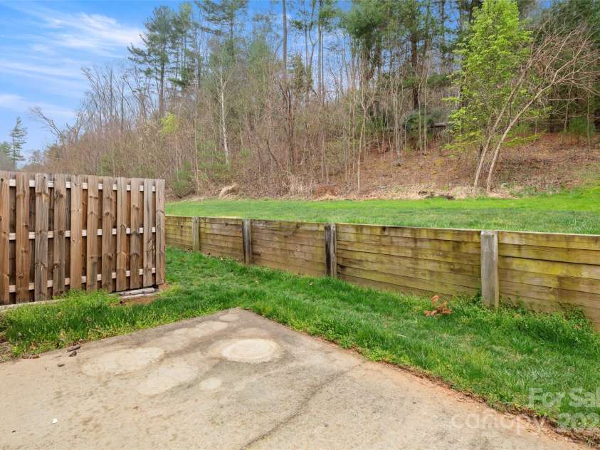 134 Alpine Ridge Drive, Asheville, NC 28803.  MLS# CAR4244493, YatesRealty ID 12600. Back Patio and Green Space