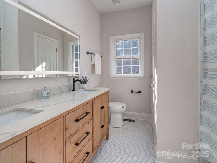 7852 Grimsby Circle, Harrisburg, NC 28075.  MLS# CAR4333886, YatesRealty ID 12602. Renovated Hall Bath