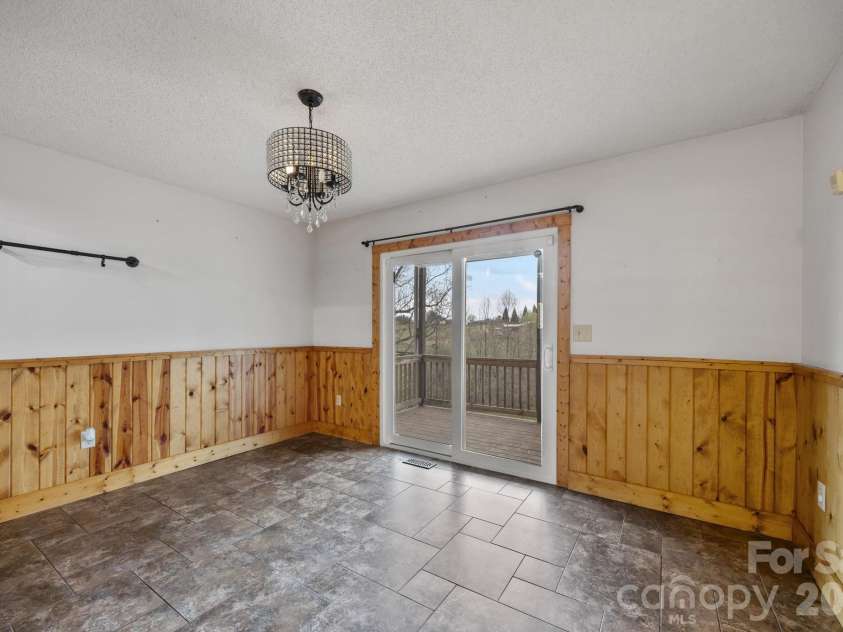 234 Justice Ridge Road, Candler, NC 28715.  MLS# CAR4359838, YatesRealty ID 12614. Dining area