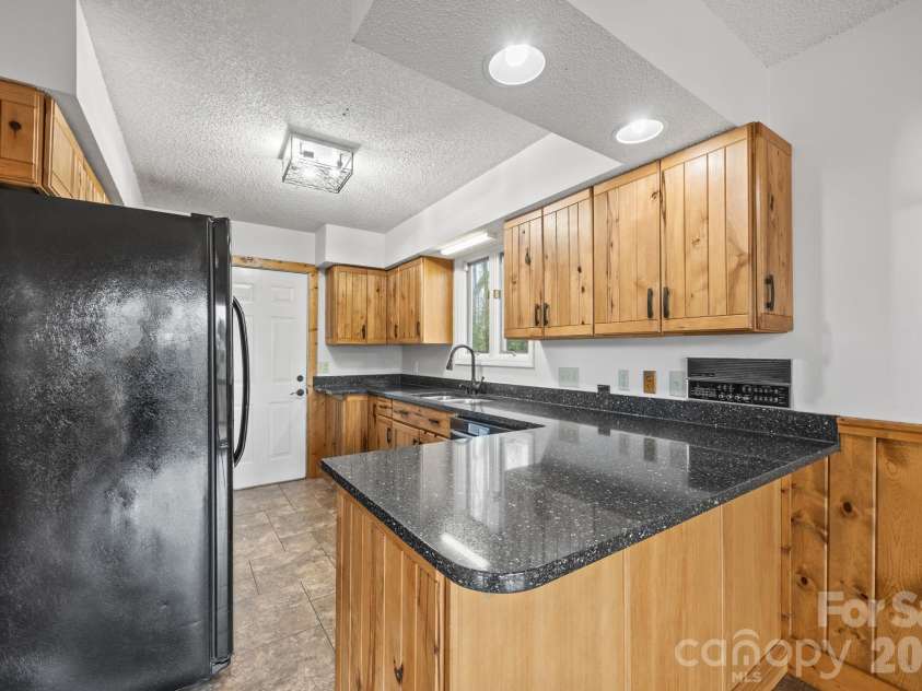 234 Justice Ridge Road, Candler, NC 28715.  MLS# CAR4359838, YatesRealty ID 12614. Kitchen