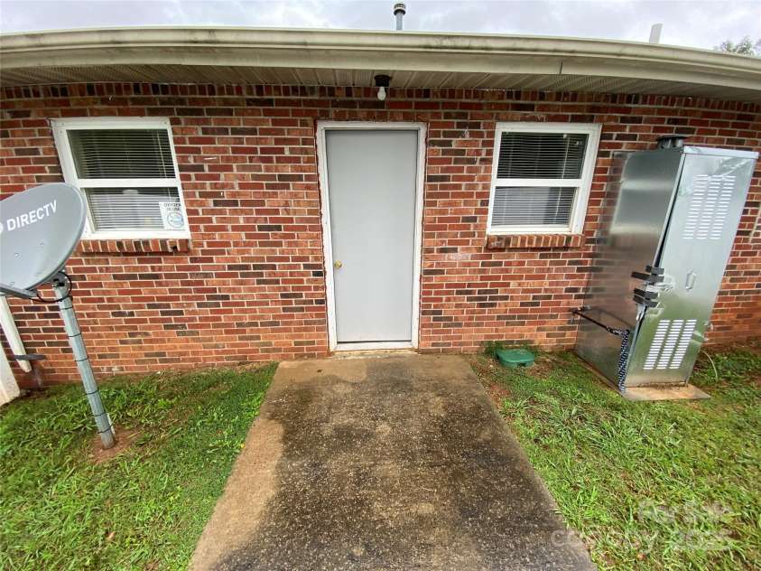 5309 Lewis Road, Gastonia, NC 28052.  MLS# CAR4257115, YatesRealty ID 12625. Unit 1- The door of the water heater is tapped close.