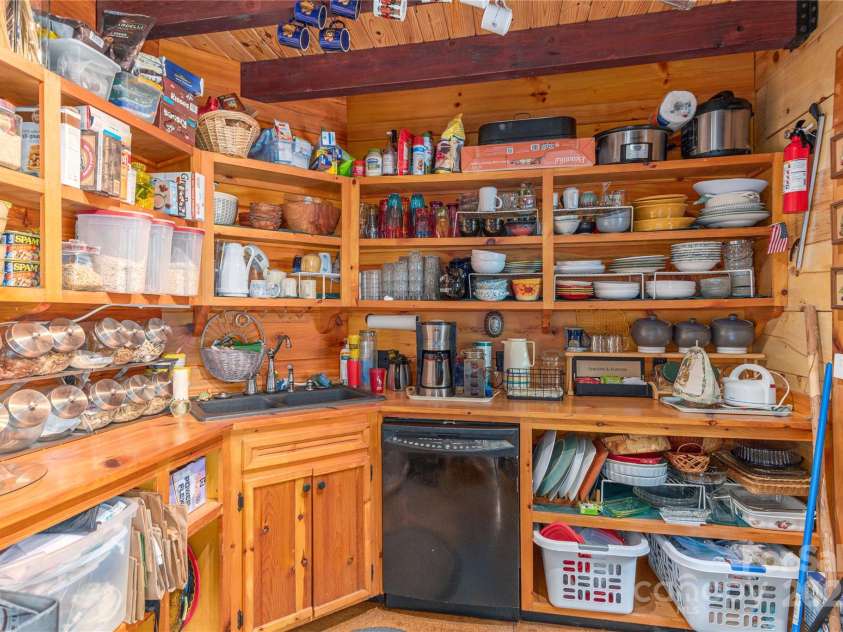 806 Twin Brook Drive, Waynesville, NC 28785.  MLS# CAR4254355, YatesRealty ID 12634. Large pantry with dishwasher and 2nd kitchen sink