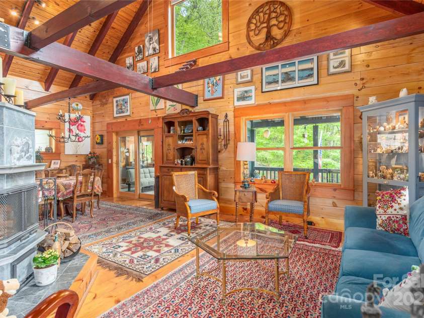 806 Twin Brook Drive, Waynesville, NC 28785.  MLS# CAR4254355, YatesRealty ID 12634. Living Room with the Tulivi Soapstone Fireplace