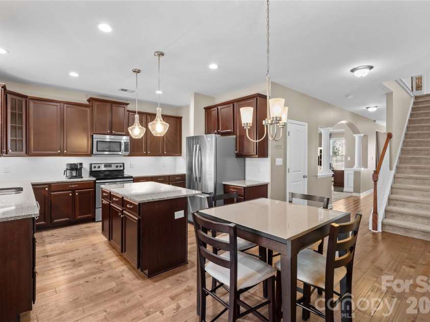 13603 Helen Benson Boulevard, Davidson, NC 28036.  MLS# CAR4341167, YatesRealty ID 12643. Dark cabinets, ss appliances & updated lighting.