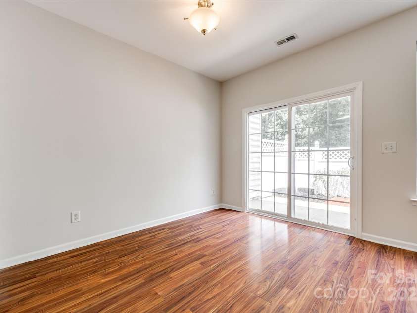 975 Copperstone Lane, Fort Mill, SC 29708.  MLS# CAR4253379, YatesRealty ID 12645. Dining area with sliding doors to fenced rear patio