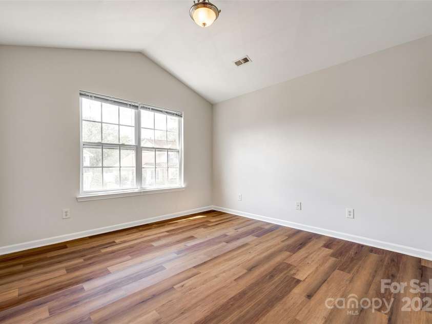 975 Copperstone Lane, Fort Mill, SC 29708.  MLS# CAR4253379, YatesRealty ID 12645. Primary bedroom upstairs with vaulted ceiling