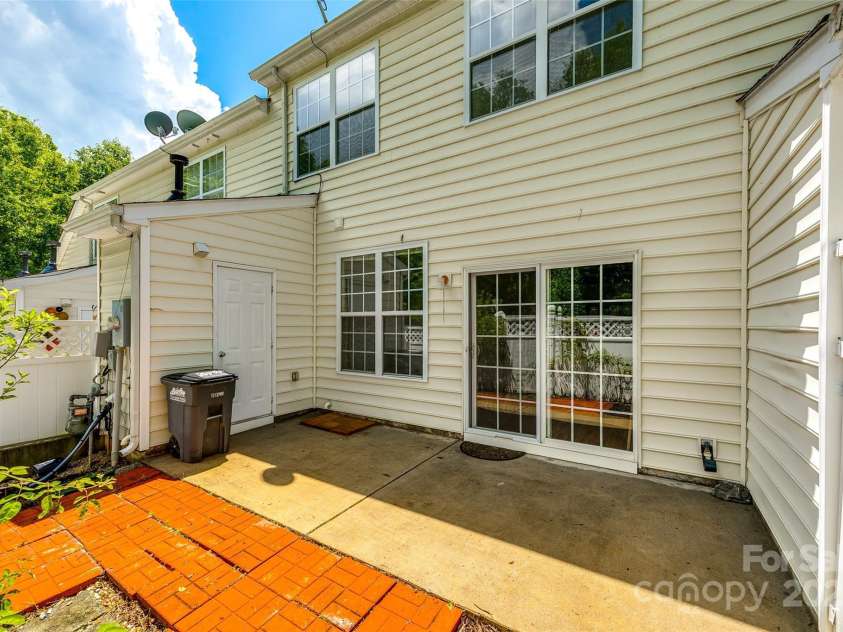 975 Copperstone Lane, Fort Mill, SC 29708.  MLS# CAR4253379, YatesRealty ID 12645. Rear of home with private patio and storage room