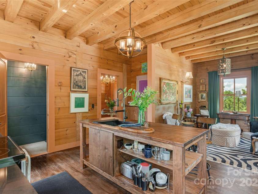 106 McCauley Drive, Asheville, NC 28803.  MLS# CAR4255495, YatesRealty ID 12646. Kitchen looking into den which can also be used as a dining area