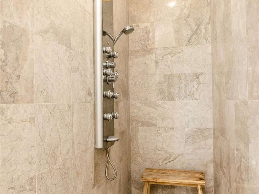 106 McCauley Drive, Asheville, NC 28803.  MLS# CAR4255495, YatesRealty ID 12646. Lower Level Shower