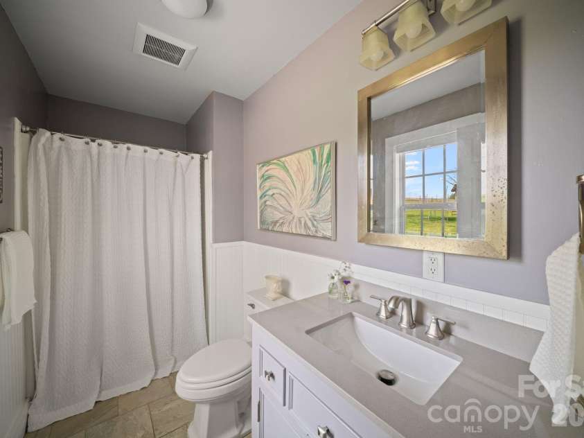 527 Floyd Blackwell Road, Tryon, NC 28782.  MLS# CAR4360131, YatesRealty ID 12649. Ensuite bath
