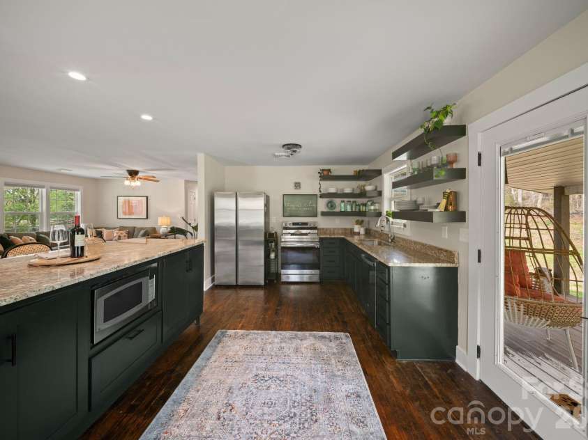 527 Floyd Blackwell Road, Tryon, NC 28782.  MLS# CAR4360131, YatesRealty ID 12649. Everyone has a work space in a kitchen this big!