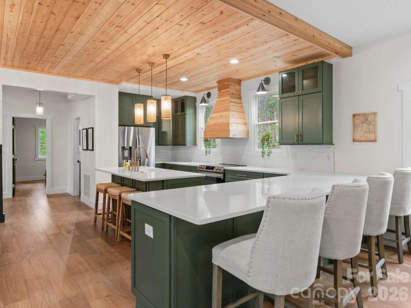 291 Webb Cove Road, Asheville, NC 28804.  MLS# CAR4369925, YatesRealty ID 12663. Oversized breakfast bar with quartz counters