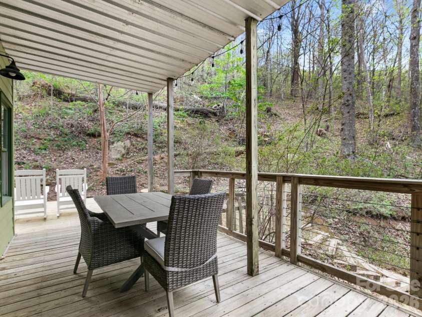 291 Webb Cove Road, Asheville, NC 28804.  MLS# CAR4369925, YatesRealty ID 12663. Side deck seating area