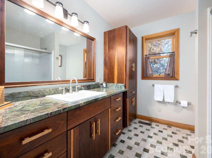 105 Avondale Heights Road, Asheville, NC 28803.  MLS# CAR4351474, YatesRealty ID 12665. Primary bath includes custom walnut vanity with curly maple handles