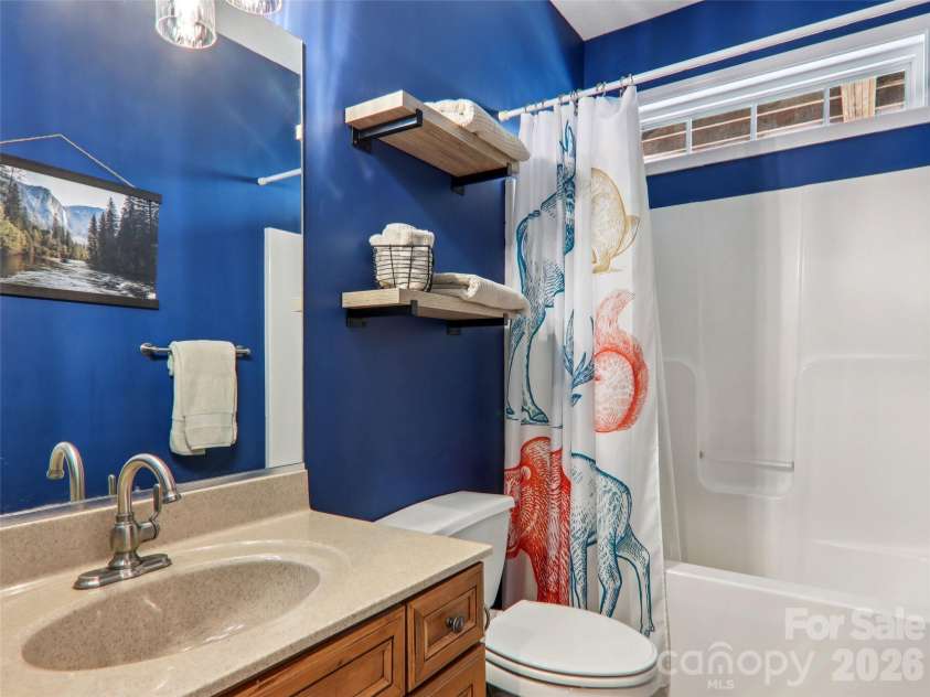 74 Woodson Drive, Mars Hill, NC 28754.  MLS# CAR4355311, YatesRealty ID 12666. Basement level full bath