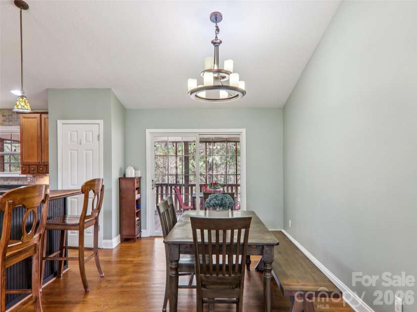 74 Woodson Drive, Mars Hill, NC 28754.  MLS# CAR4355311, YatesRealty ID 12666. Dining area off kitchen flows to screened porch 