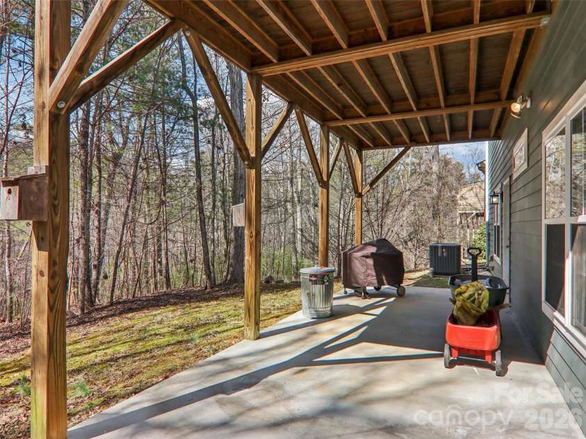 74 Woodson Drive, Mars Hill, NC 28754.  MLS# CAR4355311, YatesRealty ID 12666. Lower level porch 