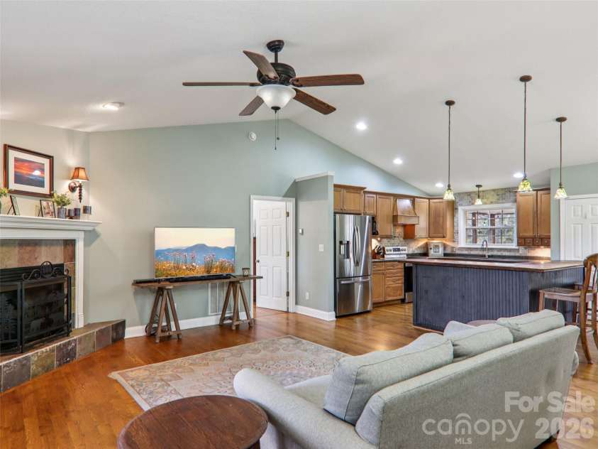 74 Woodson Drive, Mars Hill, NC 28754.  MLS# CAR4355311, YatesRealty ID 12666. Main level living area opens to kitchen & dining areas