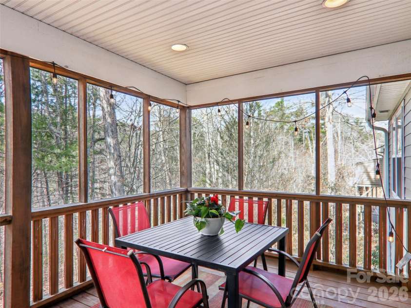 74 Woodson Drive, Mars Hill, NC 28754.  MLS# CAR4355311, YatesRealty ID 12666. Screened back deck