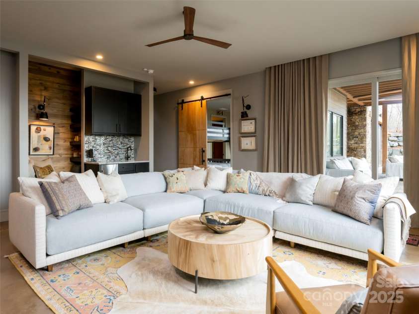 391 High Hickory Trail, Swannanoa, NC 28778.  MLS# CAR4255021, YatesRealty ID 12669. Cozy Family Room with access to Terrace - Lower Level